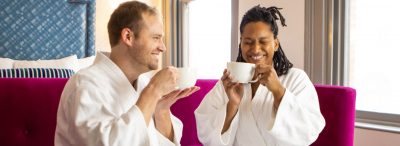 Two people drinking coffee