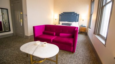 Harlow Hotel room with sleeper couch and coffee table